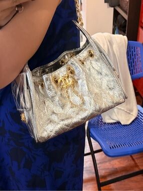 CHANEL 25C mini bucket crinkled silver leather with gold-metal hardware